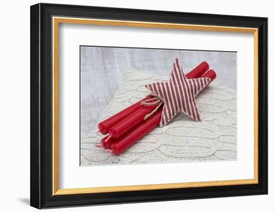 Star of Bethlehem and candles on cushion, still life-Andrea Haase-Framed Photographic Print