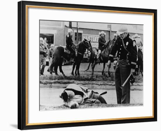 State Trooper Stands over an Injured Protester in Selma, Alabama, March 7, 1965-null-Framed Photo