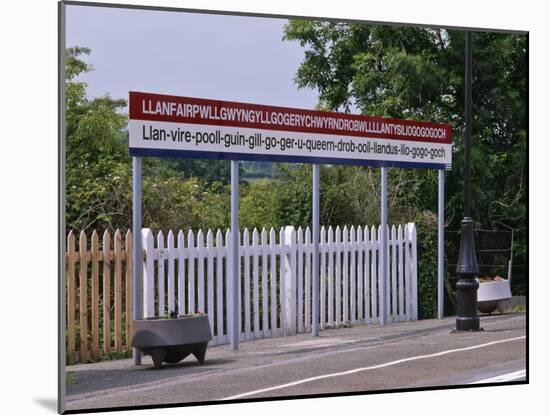 Station Sign at Llanfairpwllgwyngyllgo-Gerychwyrndrobwllllantysiliogogogoch-Nigel Blythe-Mounted Photographic Print