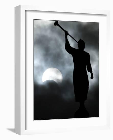 Statue is Seen Against a Cloudy Sky and a Partial Solar Eclipse in Bogota, Colombia-null-Framed Photographic Print