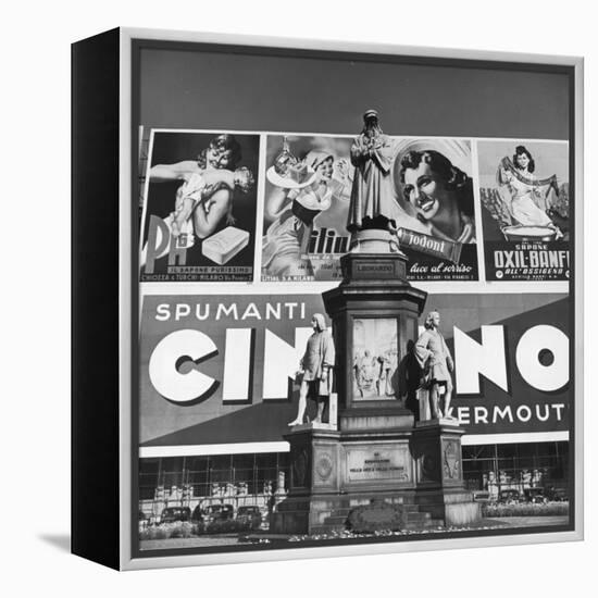 Statue of Leonardo Da Vinci on Top of Monument in Front of Giant Advertising Billboard-Alfred Eisenstaedt-Framed Premier Image Canvas