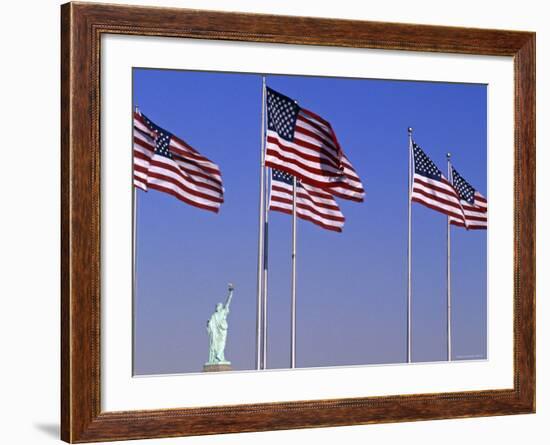 Statue of Liberty and Us Flags, New York City, USA-Walter Bibikow-Framed Photographic Print