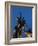 Statue of rugby players is illuminated at dusk outside Twickenham Stadium, London-Charles Bowman-Framed Photographic Print