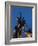 Statue of rugby players is illuminated at dusk outside Twickenham Stadium, London-Charles Bowman-Framed Photographic Print