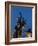 Statue of rugby players is illuminated at dusk outside Twickenham Stadium, London-Charles Bowman-Framed Photographic Print