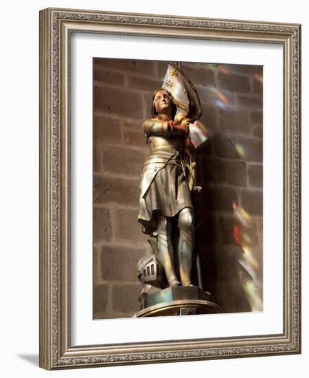 Statue of St. Joan of Arc with Coloured Light from Stained Glass, Church of Notre Dame, Vitre, Brit-Nick Servian-Framed Photographic Print