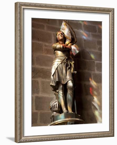 Statue of St. Joan of Arc with Coloured Light from Stained Glass, Church of Notre Dame, Vitre, Brit-Nick Servian-Framed Photographic Print