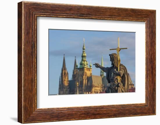 Statue of St. John the Baptist on the Charles Bridge with the Prague Castle and St. Vitus Cathedral-Tom Haseltine-Framed Photographic Print