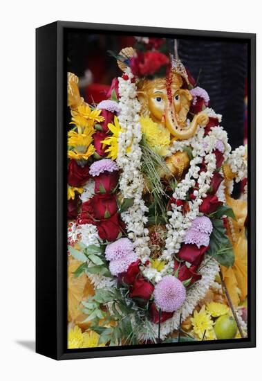 Statue of the Hindu God Ganesh with Garlands, Paris, France, Europe-Godong-Framed Premier Image Canvas