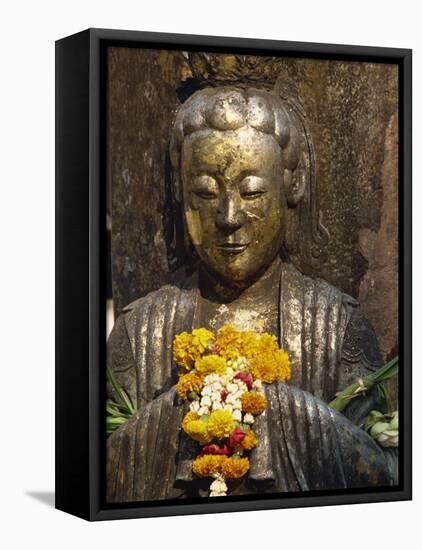 Statue with Offering of Marigold Flowers, Emerald Buddha Temple, Bangkok, Thailand, Southeast Asia-Alain Evrard-Framed Premier Image Canvas