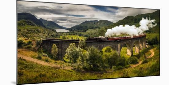 Steam train moving on old bridge, Scotland-null-Mounted Photographic Print