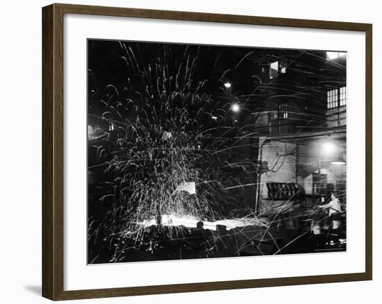 Steel Worker Mrs. Florence Romanowski Operating Stamping Machine that brands into steels-Margaret Bourke-White-Framed Photographic Print