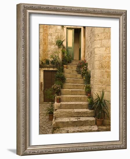 Steps with plants outside historic stone house, Trogir, Dalamatia, Croatia-Merrill Images-Framed Photographic Print