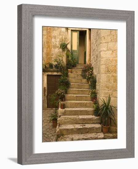 Steps with plants outside historic stone house, Trogir, Dalamatia, Croatia-Merrill Images-Framed Photographic Print