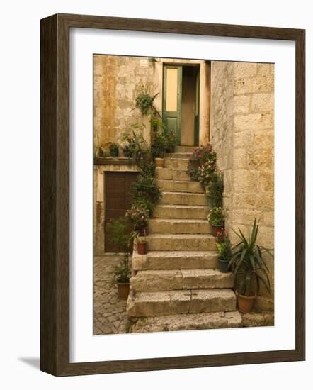 Steps with plants outside historic stone house, Trogir, Dalamatia, Croatia-Merrill Images-Framed Photographic Print