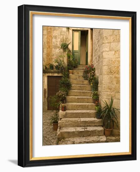 Steps with plants outside historic stone house, Trogir, Dalamatia, Croatia-Merrill Images-Framed Photographic Print