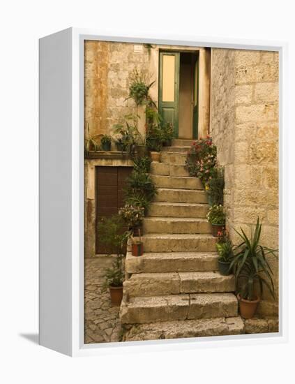 Steps with plants outside historic stone house, Trogir, Dalamatia, Croatia-Merrill Images-Framed Premier Image Canvas