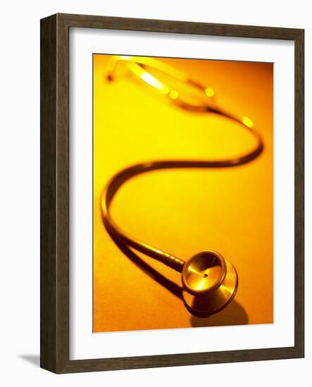 Stethoscope on Yellow Surface-null-Framed Photographic Print