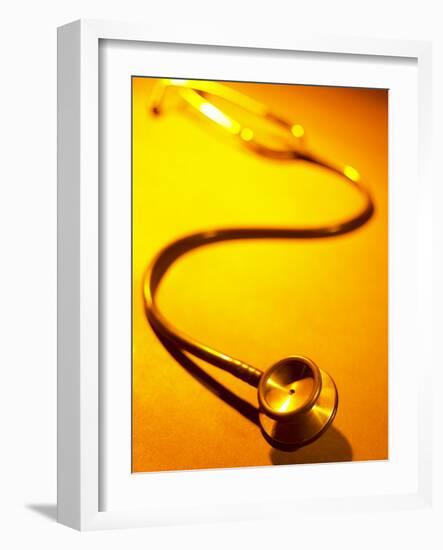 Stethoscope on Yellow Surface-null-Framed Photographic Print