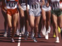 Blurred Action of Women Runners During a Track Race-Steven Sutton-Framed Photographic Print