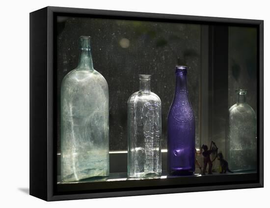 Still Life With Bottles And Found Figurines-Geoffrey Ansel Agrons-Framed Premier Image Canvas