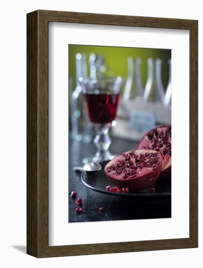 Still Life with Sliced Pomegranate, Glass with Pomegranate Juice and Bottle-Jana Ihle-Framed Photographic Print