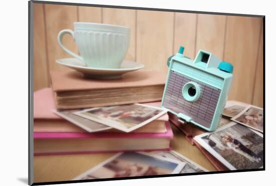 Still Life with Vintage Camera and Photos. Blur Effect, Focus on Camera-soupstock-Mounted Photographic Print