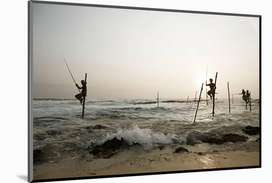 Stilt fisherman in Sri Lanka-Rasmus Kaessmann-Mounted Photographic Print