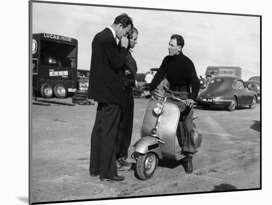 Stirling Moss on a Vespa Scooter, Goodwood, April 1952-null-Mounted Photographic Print