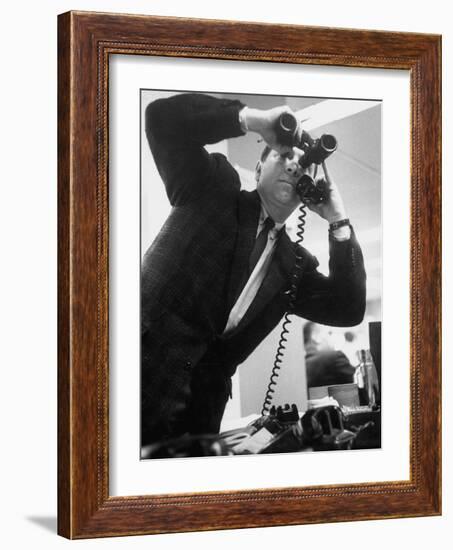 Stock Market Salesman with Binoculars-Yale Joel-Framed Photographic Print