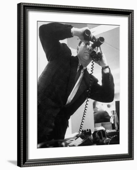 Stock Market Salesman with Binoculars-Yale Joel-Framed Photographic Print