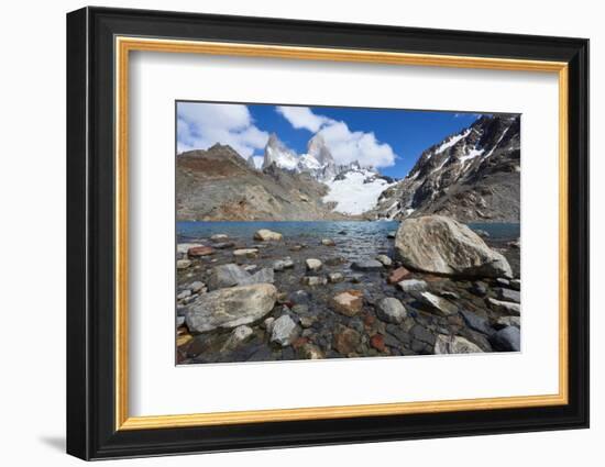 Stones seen through the water of Lago de los Tres featuring Monte Fitz Roy in the background. Monte-Fernando Carniel Machado-Framed Photographic Print