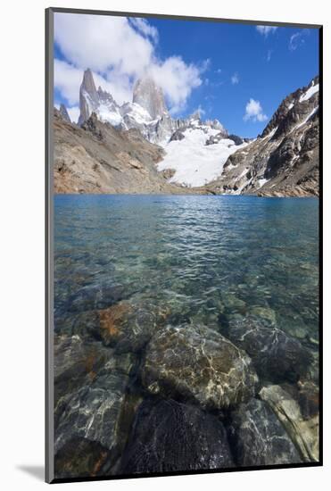 Stones seen through the water of Lago de los Tres featuring Monte Fitz Roy in the background, Patag-Fernando Carniel Machado-Mounted Photographic Print