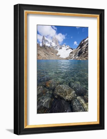 Stones seen through the water of Lago de los Tres featuring Monte Fitz Roy in the background, Patag-Fernando Carniel Machado-Framed Photographic Print