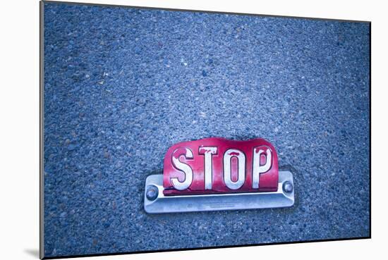 Stop Sign On Asphalt-Justin Bailie-Mounted Photographic Print