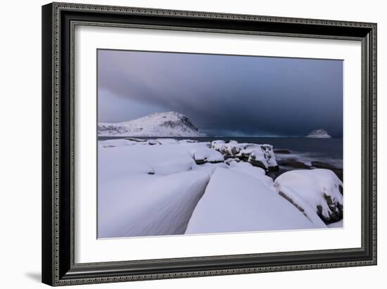 Storm clouds on the snowy peaks reflected in the cold sea at night, Haukland, Northern Norway-Roberto Moiola-Framed Photographic Print