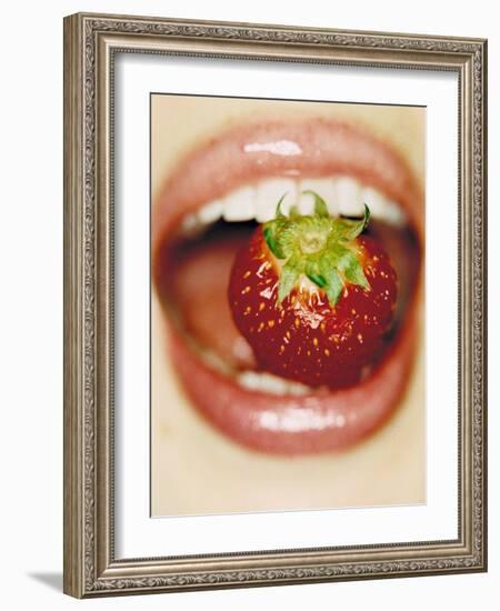 Strawberry Between Teeth-Cristina-Framed Photographic Print