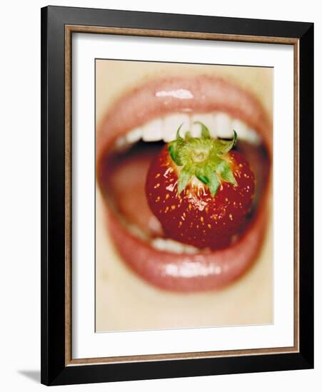 Strawberry Between Teeth-Cristina-Framed Photographic Print