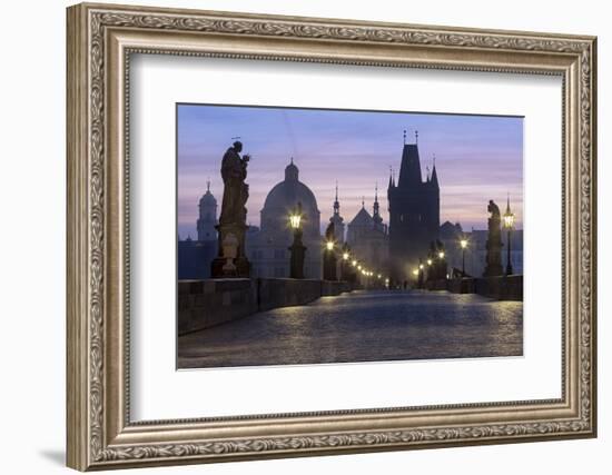 Street lanterns and old statues frame the historical buildings on Charles Bridge at dawn, UNESCO Wo-Roberto Moiola-Framed Photographic Print