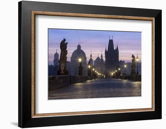 Street lanterns and old statues frame the historical buildings on Charles Bridge at dawn, UNESCO Wo-Roberto Moiola-Framed Photographic Print