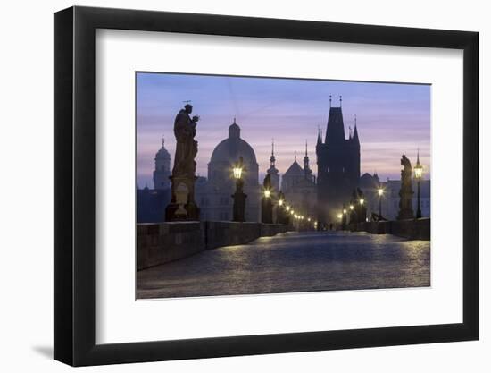 Street lanterns and old statues frame the historical buildings on Charles Bridge at dawn, UNESCO Wo-Roberto Moiola-Framed Photographic Print