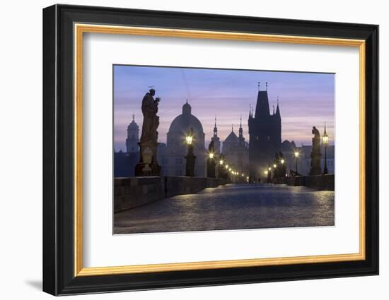 Street lanterns and old statues frame the historical buildings on Charles Bridge at dawn, UNESCO Wo-Roberto Moiola-Framed Photographic Print