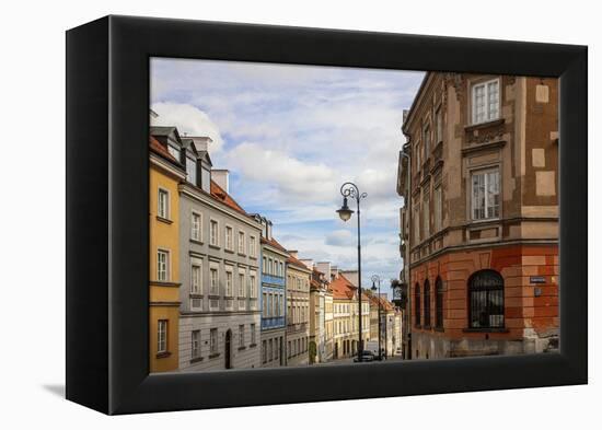 Street of homes is off the main square in Old Town Warsaw. Homes have been restored-Mallorie Ostrowitz-Framed Premier Image Canvas