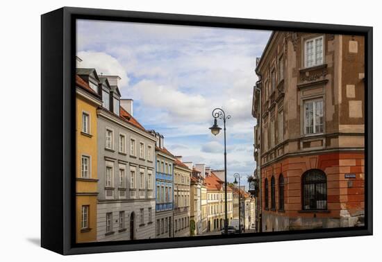 Street of homes is off the main square in Old Town Warsaw. Homes have been restored-Mallorie Ostrowitz-Framed Premier Image Canvas