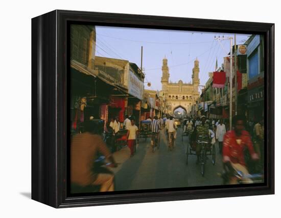 Street Scene with Bicycles and Rickshaw and the Char Minar Triumphal Arch Built in 1591, India-John Henry Claude Wilson-Framed Premier Image Canvas