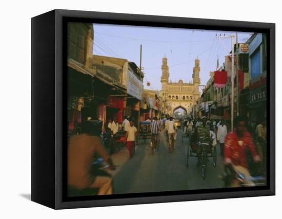 Street Scene with Bicycles and Rickshaw and the Char Minar Triumphal Arch Built in 1591, India-John Henry Claude Wilson-Framed Premier Image Canvas