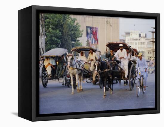 Street Scene with Horse Drawn Carriages, Rawalpindi, Punjab, Pakistan-David Poole-Framed Premier Image Canvas