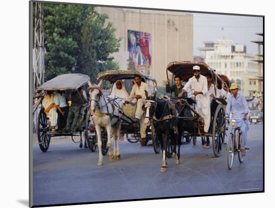 Street Scene with Horse Drawn Carriages, Rawalpindi, Punjab, Pakistan-David Poole-Mounted Photographic Print