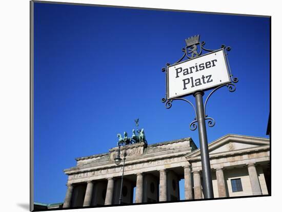 Street Sign and Brandenburg Gate, Berlin, Germany-Hans Peter Merten-Mounted Photographic Print