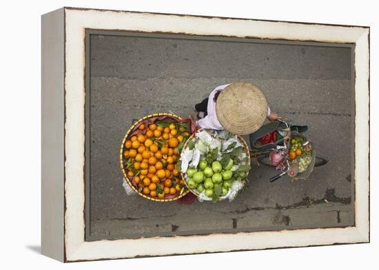 Street vendor with baskets of fruit on bicycle, Old Quarter, Hanoi, Vietnam-David Wall-Framed Premier Image Canvas